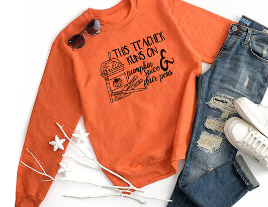 This Teacher Runs on Pumpkin Spice & Pens Sweatshirt (Black Graphic)